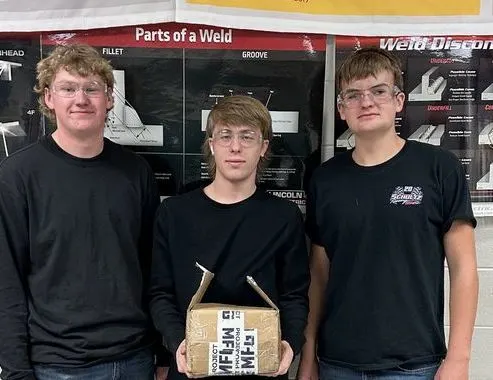 student welders in group photo